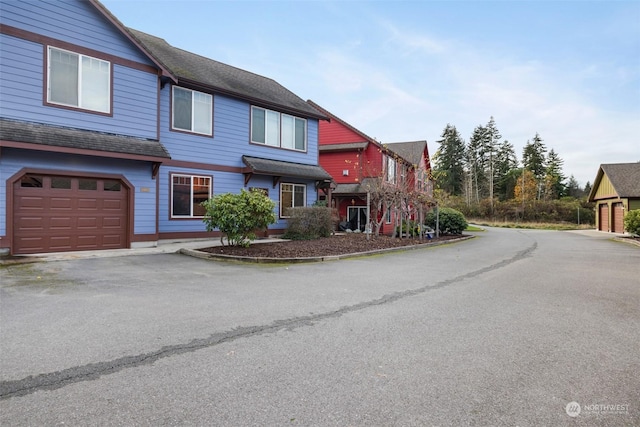 2606 Peach Ct Unit B, Port Angeles, WA 98363 - townhome / multi-family property with asphalt driveway, roof with shingles, and an attached garage