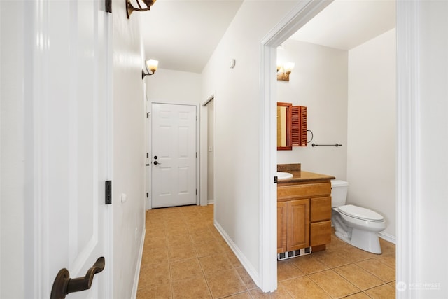 hall featuring light tile patterned flooring