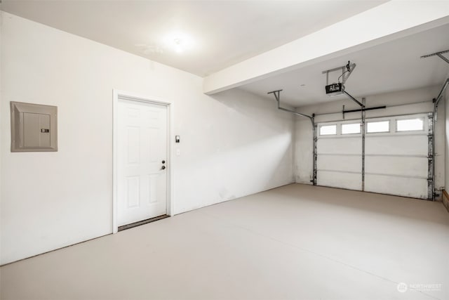 garage with electric panel and a garage door opener