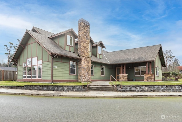 2606 Peach Ct Unit B, Port Angeles, WA 98363 - view of front of property featuring a chimney, board and batten siding, and a shingled roof