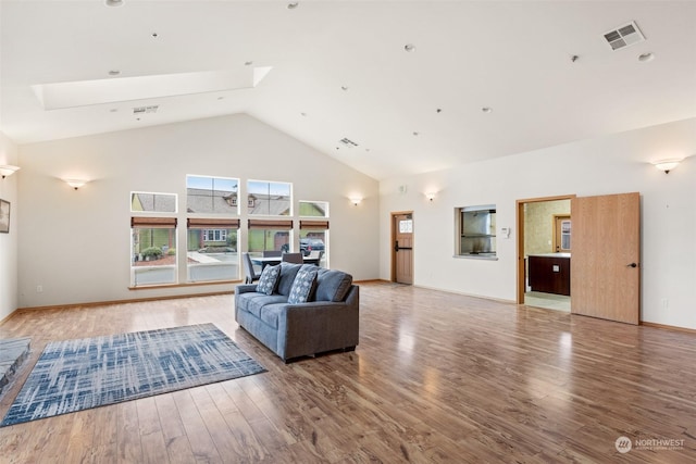2606 Peach Ct Unit B, Port Angeles, WA 98363 - living room featuring wood finished floors and high vaulted ceiling