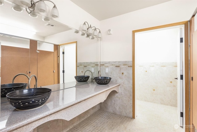 2606 Peach Ct Unit B, Port Angeles, WA 98363 - full bath featuring a wainscoted wall, tile patterned flooring, and a sink