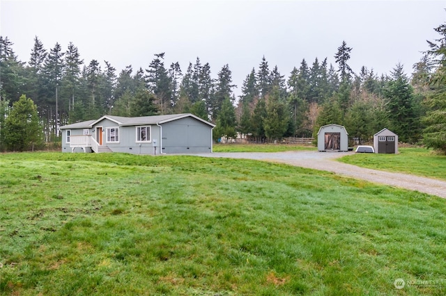 view of yard with a storage unit and covered porch