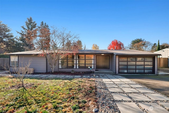 single story home featuring a garage