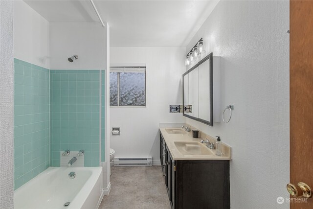 full bath with bathtub / shower combination, baseboard heating, a sink, and toilet