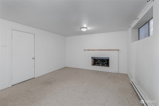 unfurnished living room featuring carpet floors, a baseboard radiator, and a fireplace