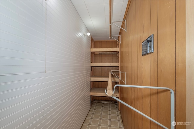 spacious closet with tile patterned floors