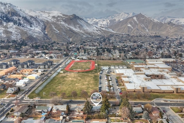 birds eye view of property featuring a mountain view