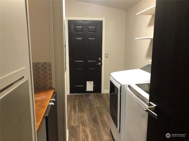 laundry area featuring separate washer and dryer and dark hardwood / wood-style floors