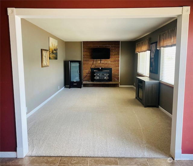 1769 SW Bay St, Port Orchard, WA 98366 - unfurnished living room featuring light colored carpet, a fireplace, and baseboards