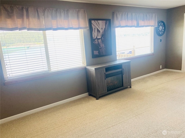 1769 SW Bay St, Port Orchard, WA 98366 - spare room featuring light colored carpet and baseboards