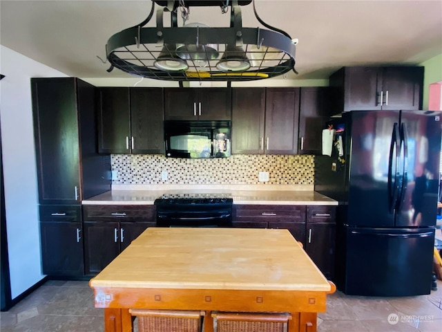 1769 SW Bay St, Port Orchard, WA 98366 - kitchen with black appliances, light countertops, tile patterned floors, and decorative backsplash