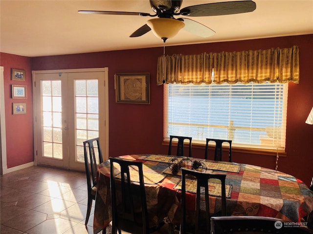 1769 SW Bay St, Port Orchard, WA 98366 - tiled dining room with french doors, ceiling fan, and baseboards