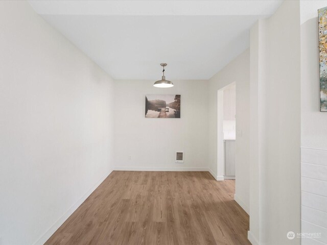 unfurnished dining area with light hardwood / wood-style floors