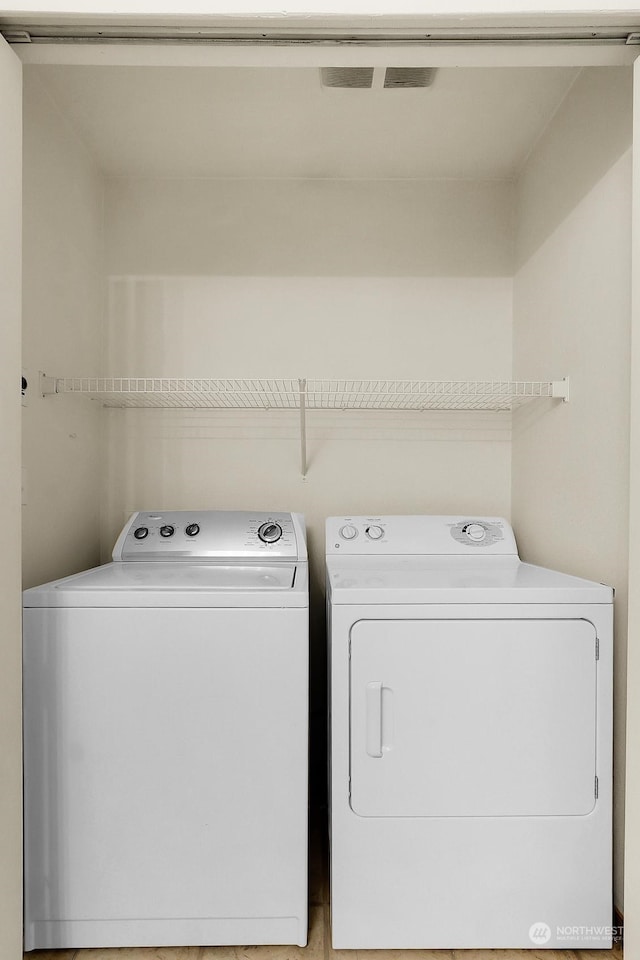 laundry area featuring washer and clothes dryer