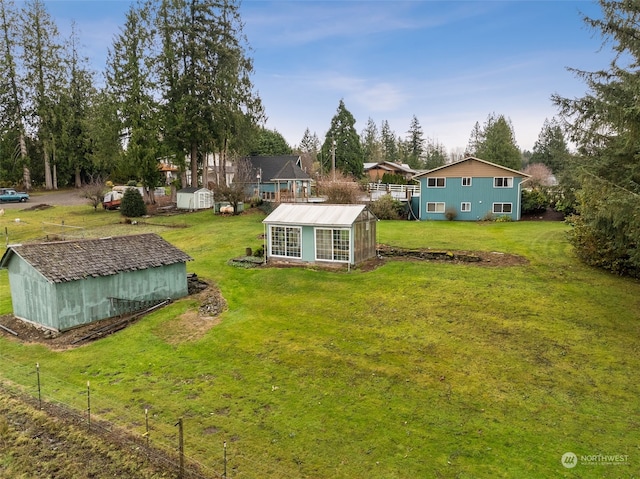 view of yard with a storage unit