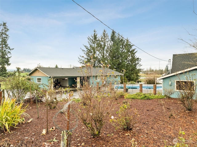 exterior space with a swimming pool and a patio area