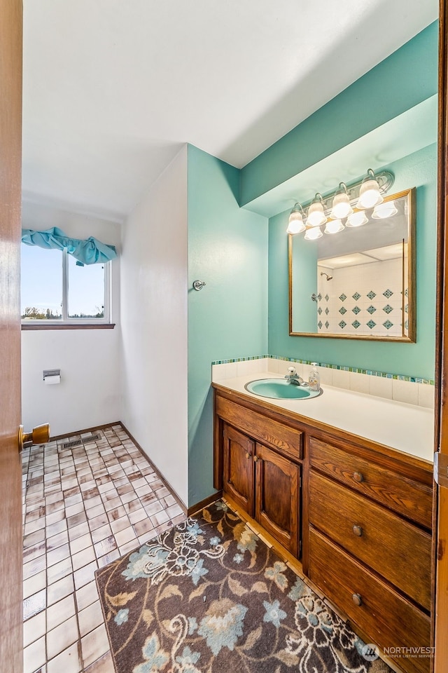 bathroom featuring vanity and tile patterned flooring