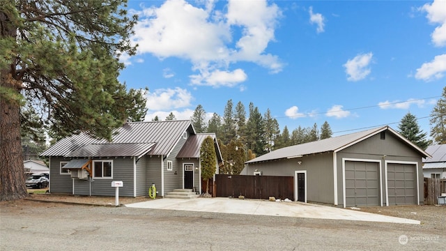 view of front facade with an outdoor structure and a garage