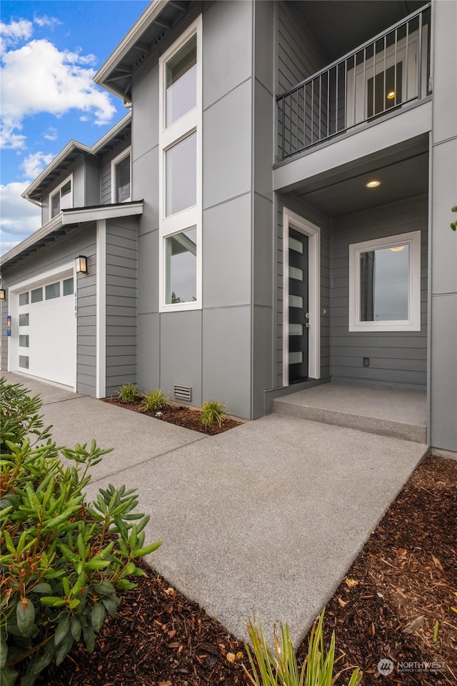 view of side of property with a garage