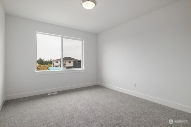 empty room with carpet flooring