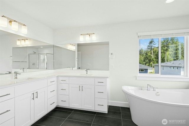 6202 229th Ave E, Buckley, WA 98321 - bathroom featuring a stall shower, tile patterned flooring, double vanity, and a freestanding tub