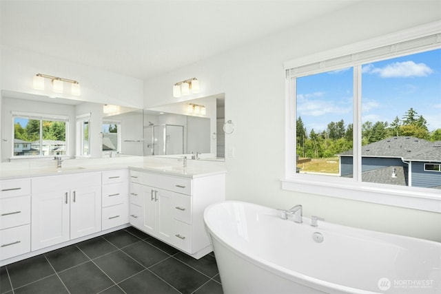 6202 229th Ave E, Buckley, WA 98321 - full bath featuring double vanity, a freestanding bath, tile patterned floors, and a shower