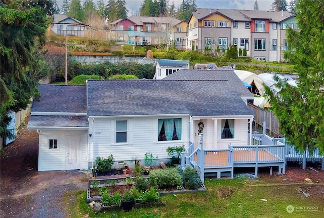 back of property featuring a wooden deck