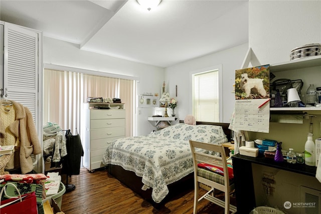 bedroom featuring dark wood-type flooring