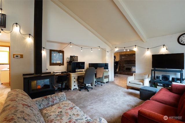 carpeted living room with beamed ceiling and high vaulted ceiling