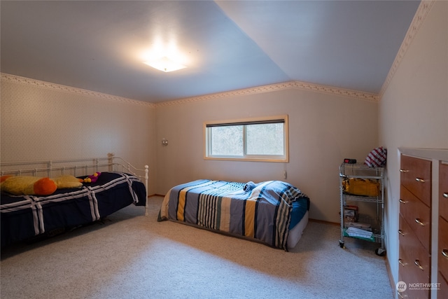 carpeted bedroom featuring lofted ceiling