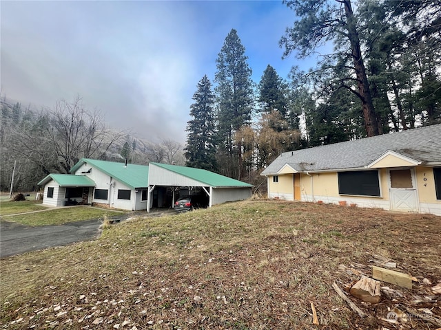 view of side of property with a carport