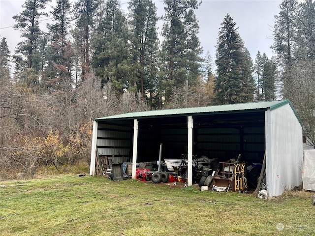 view of outbuilding featuring a yard