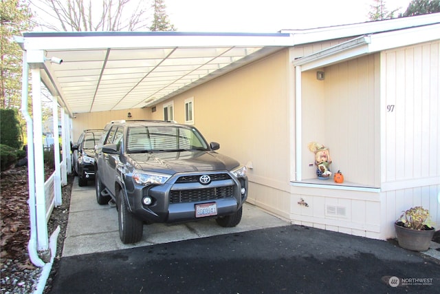 view of parking featuring a carport