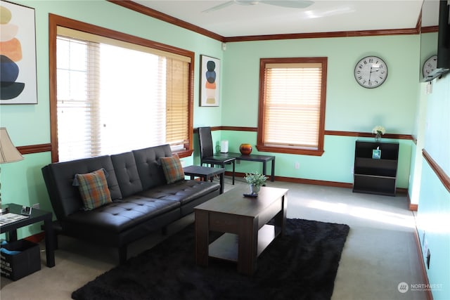 living room with light carpet, plenty of natural light, and ornamental molding