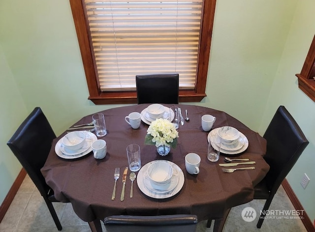 dining room featuring light tile patterned flooring