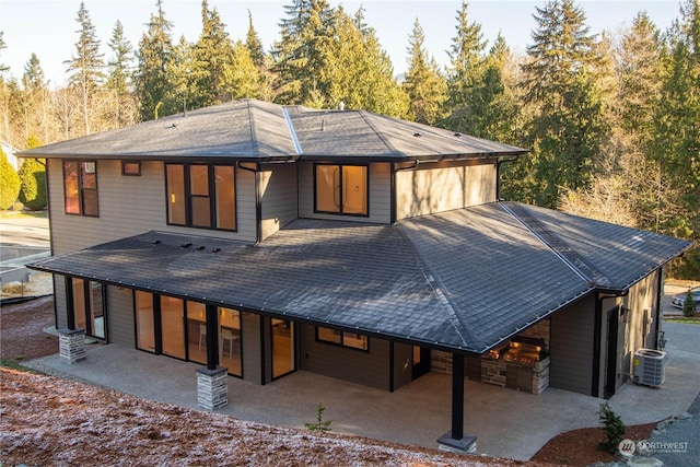 back of house featuring central AC and a patio