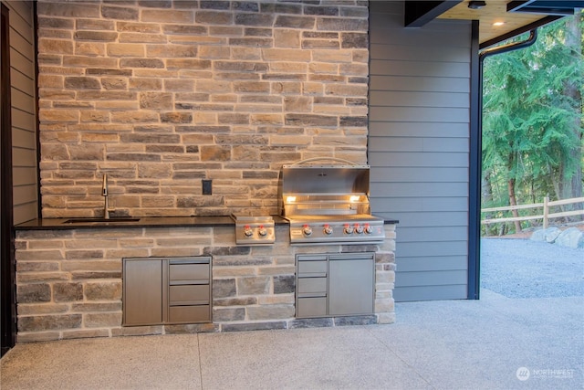 view of patio / terrace with grilling area and an outdoor kitchen