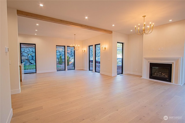 unfurnished living room featuring beamed ceiling, light hardwood / wood-style flooring, and a notable chandelier