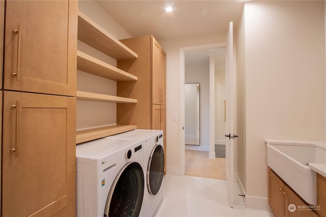 laundry area featuring cabinets and independent washer and dryer