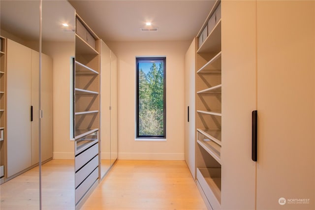 walk in closet featuring light wood-type flooring