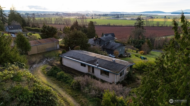 birds eye view of property featuring a mountain view and a rural view