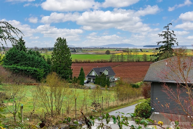 drone / aerial view with a mountain view and a rural view