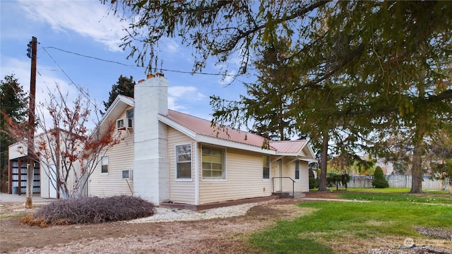 exterior space featuring a lawn, a wall mounted AC, and a garage