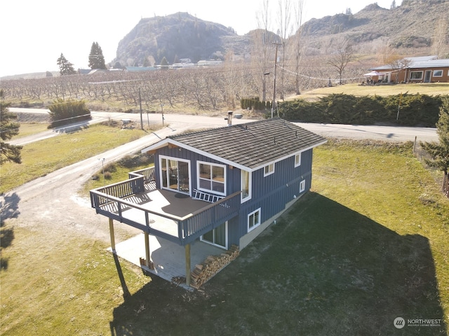 drone / aerial view featuring a mountain view and a rural view