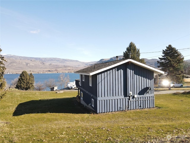 76B Westlake Rd, Oroville, WA 98844 - view of side of home featuring a yard, a water and mountain view, and board and batten siding