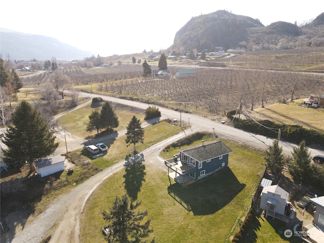 drone / aerial view featuring a mountain view and a rural view