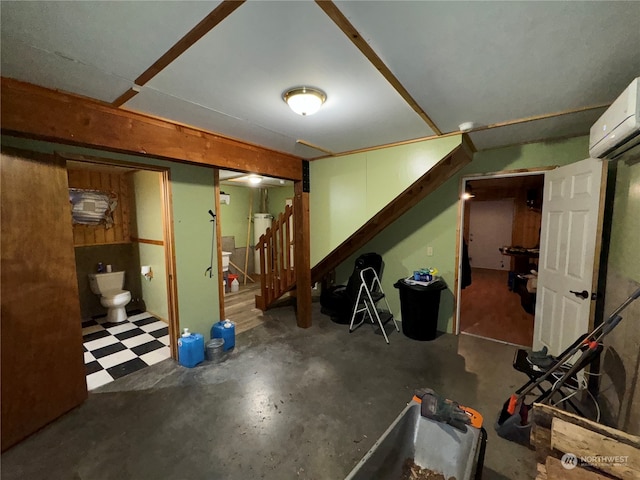 basement featuring an AC wall unit