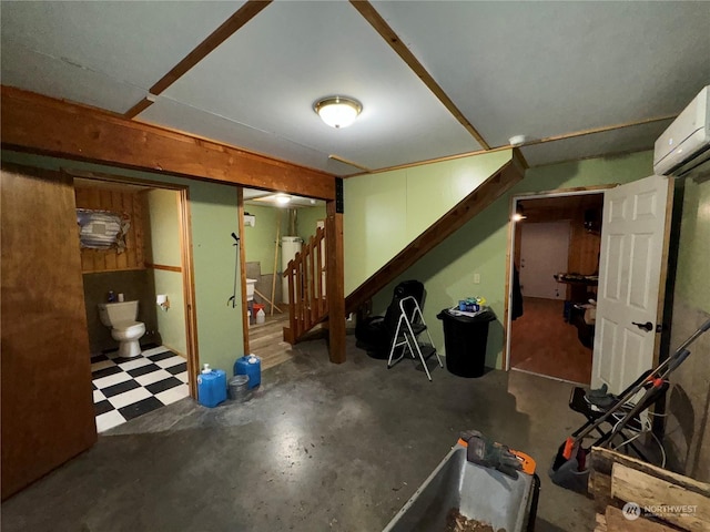 76B Westlake Rd, Oroville, WA 98844 - finished below grade area with stairs, a wall unit AC, and tile patterned floors