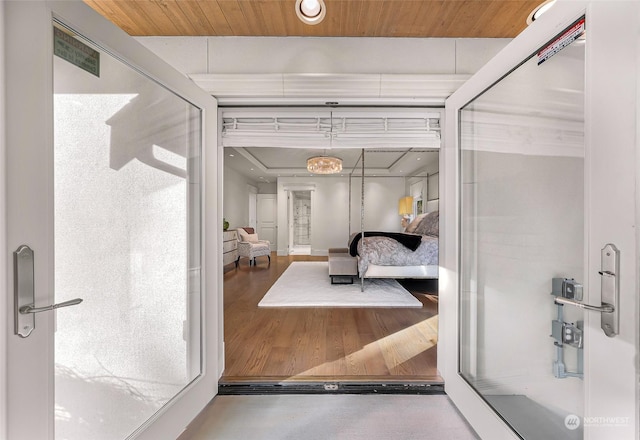 bathroom featuring wood-type flooring and wooden ceiling